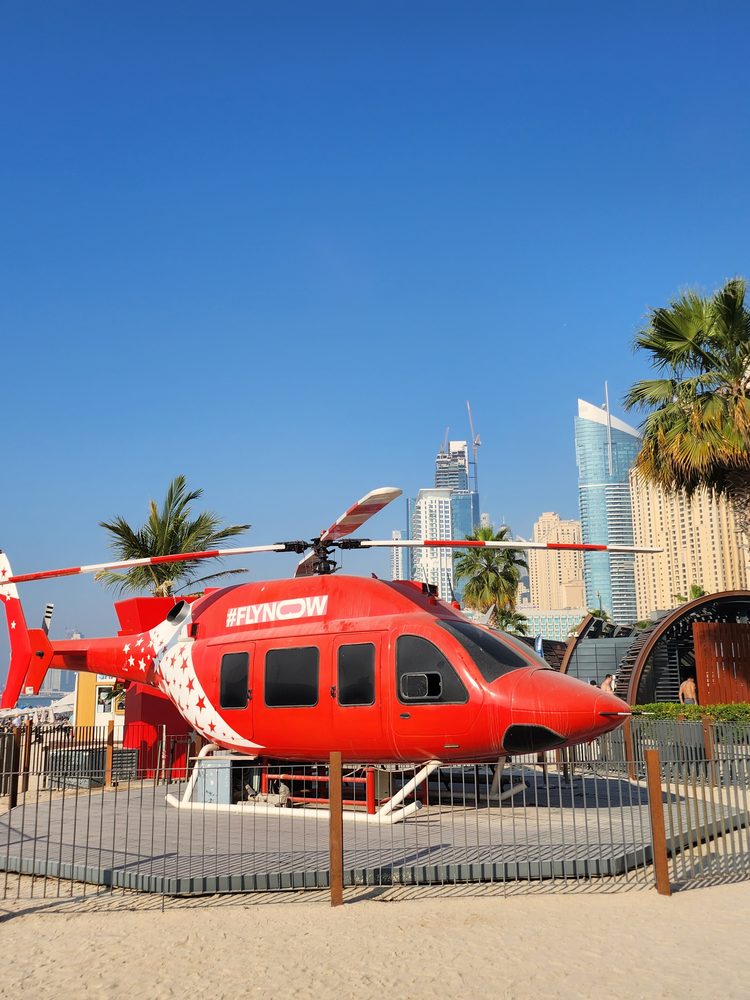 Helicopter on the Dubai beachfront with skyline behind