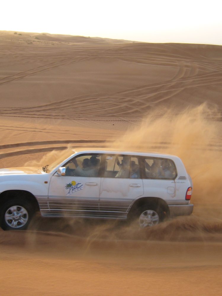 4x4 desert safari kicking up sand in the Dubai desert