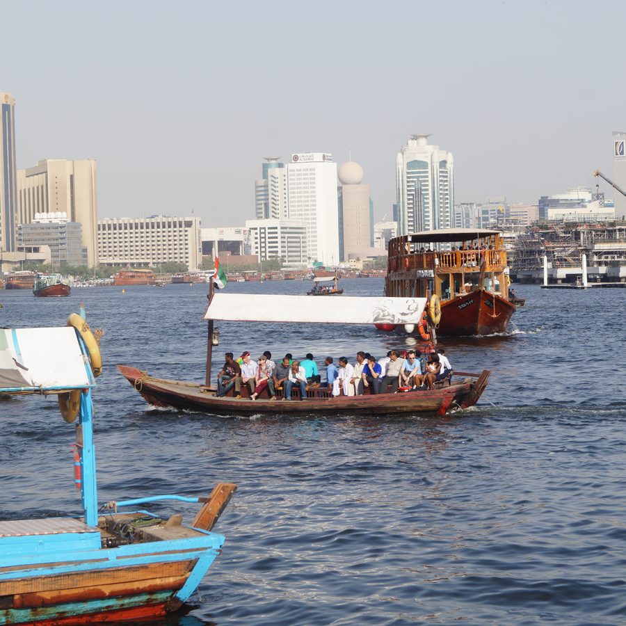 Traditional dhow boat cruising on Dubai Creek